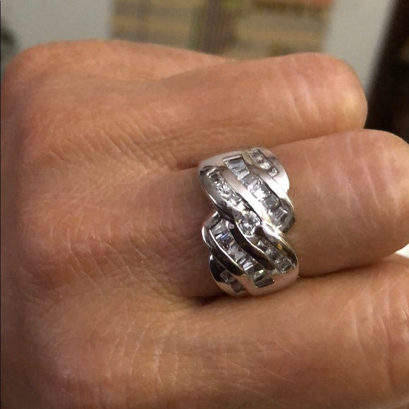 Ring Made of 9/5 Silver; and imitation diamond.
